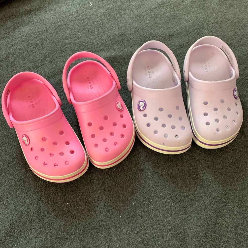 2 pairs of Crocs